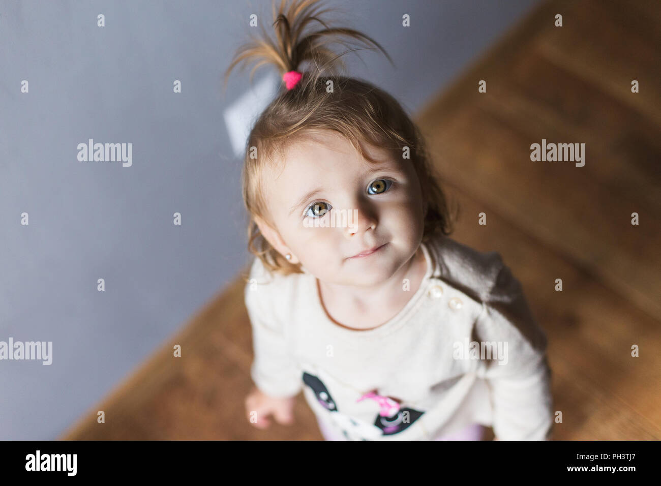Cute little girl at real home Stock Photo - Alamy