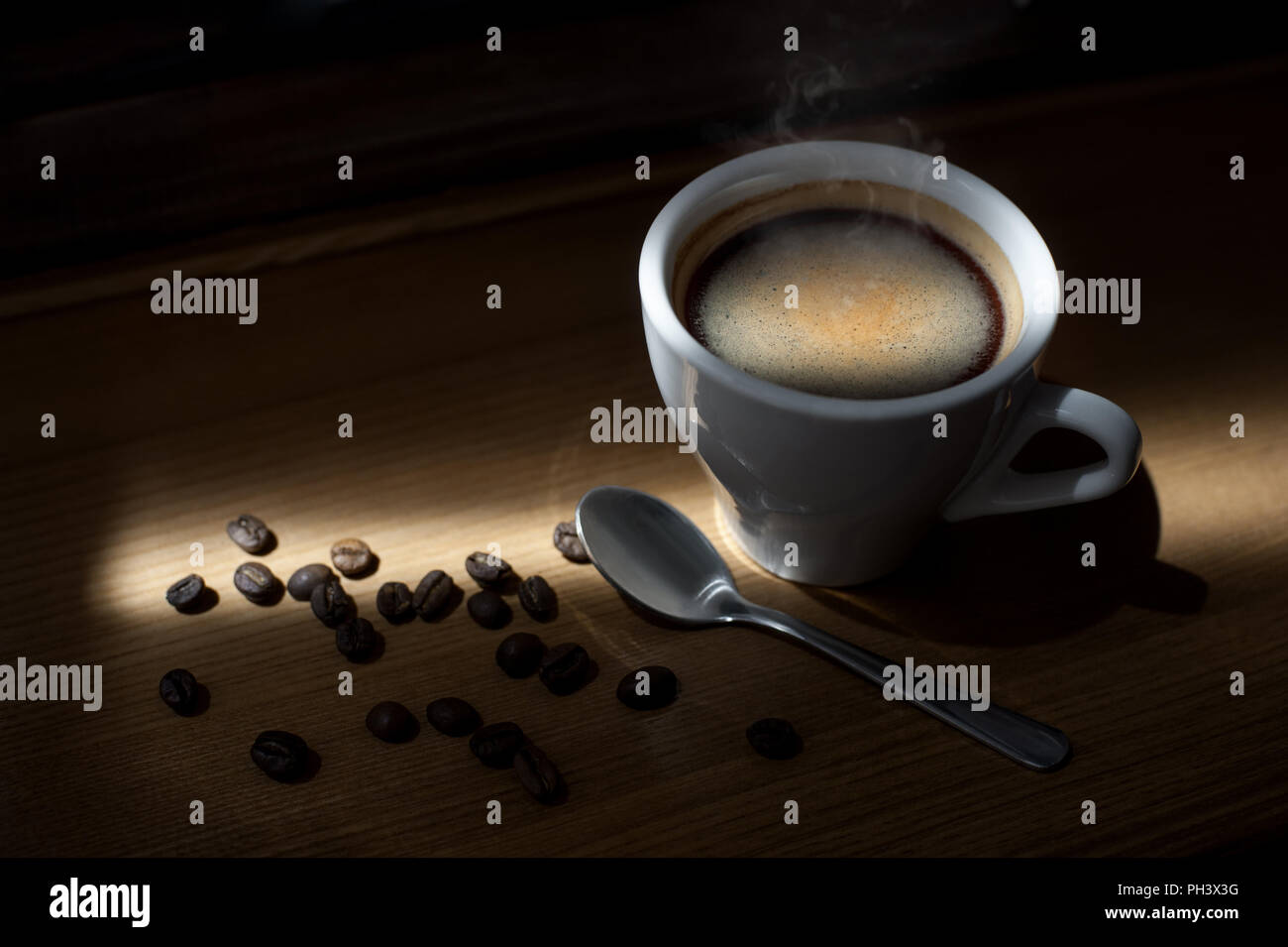 https://c8.alamy.com/comp/PH3X3G/hot-coffee-cappuccino-cup-with-milk-foam-on-wood-table-background-PH3X3G.jpg
