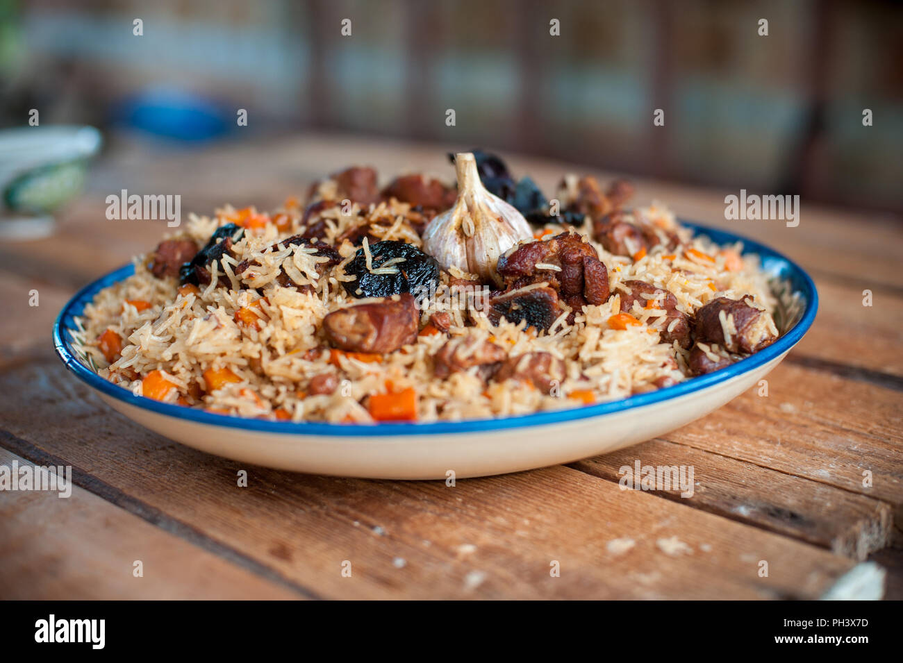 Basmati rice pilaf with pepper, onion prunes, garlic and beef Stock