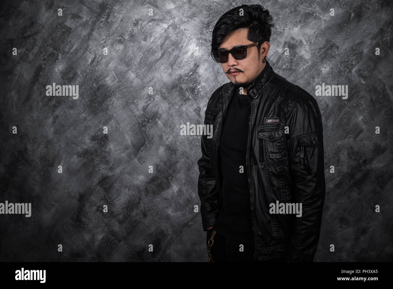 portrait of biker man in black leather jacket Stock Photo