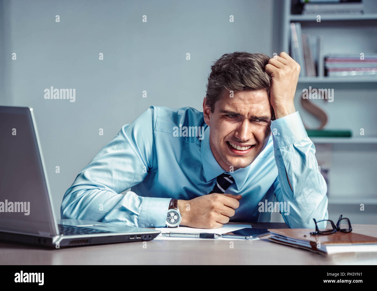 Crying man. Photo of office man with Negative facial expression at the working place, depression and crisis concept Stock Photo