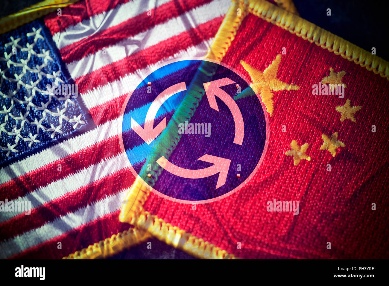 Flags of the USA and China and roundabout traffic sign, tariff war Stock Photo