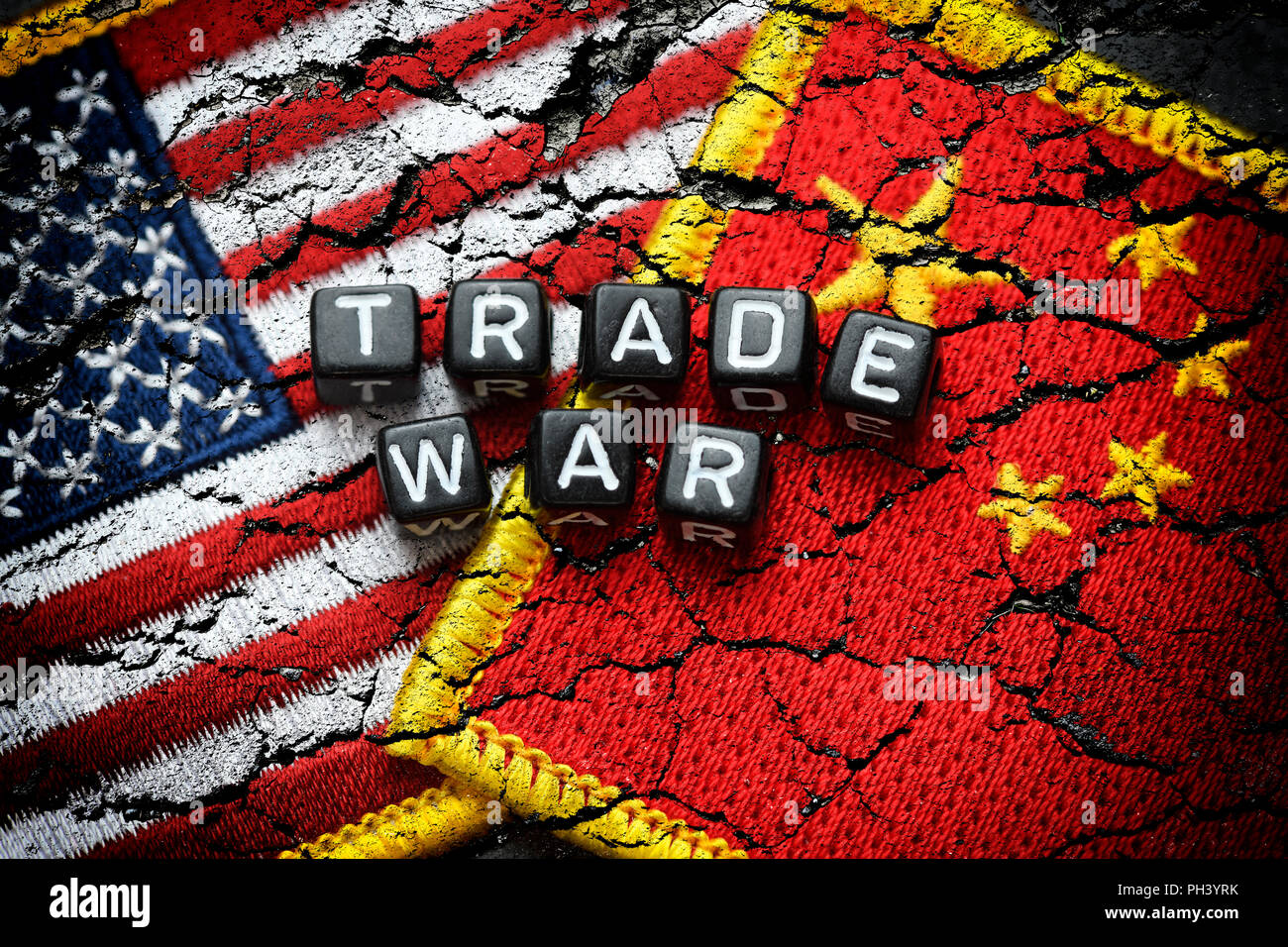 Flags of the USA and China on broken ground, trade war Stock Photo