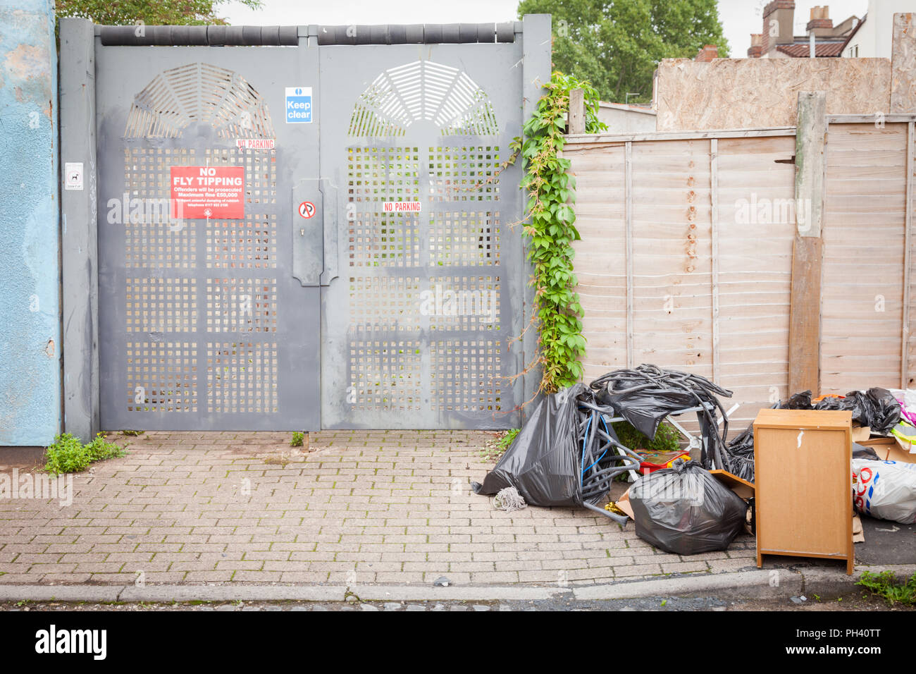 Rubbish or garbage dumped or fly tipping in a street in Bristol UK Stock Photo