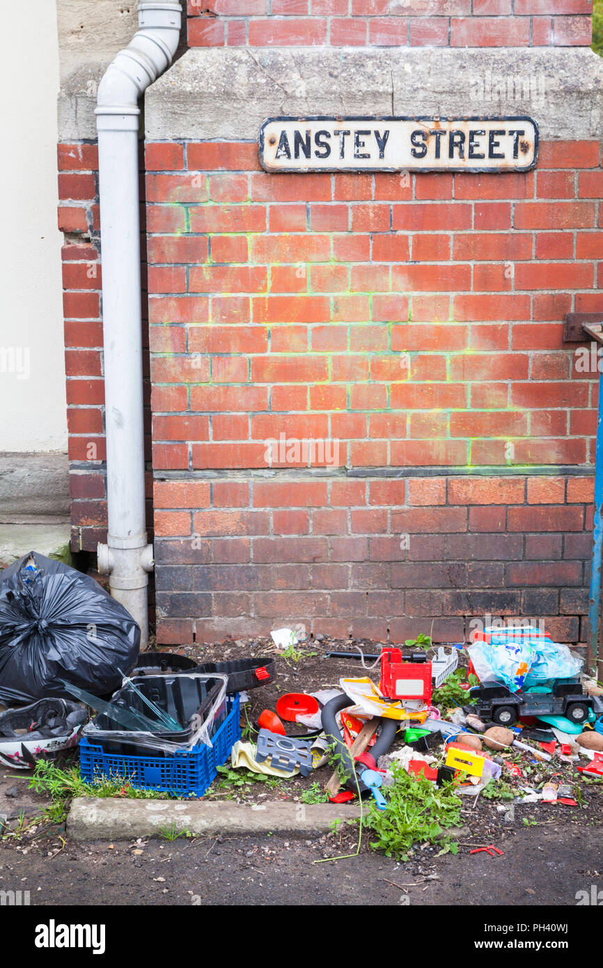 Rubbish or garbage dumped or fly tipping in a street in Bristol UK Stock Photo