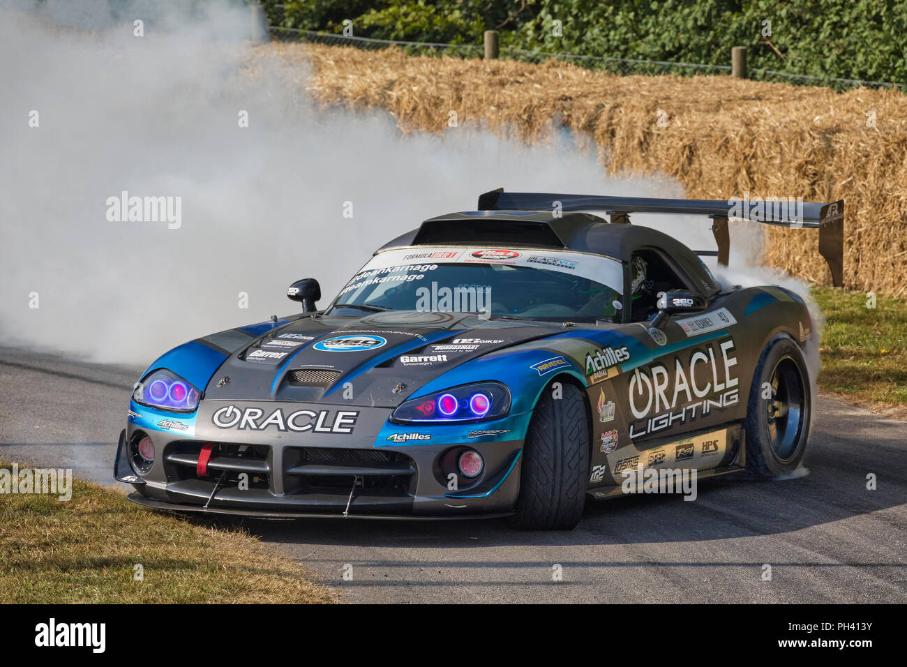 2016 Dodge Viper Formula Drift car with driver Dean Kearney burning rubber at the 2018 Goodwood Festival of Speed, Sussex, UK. Stock Photo