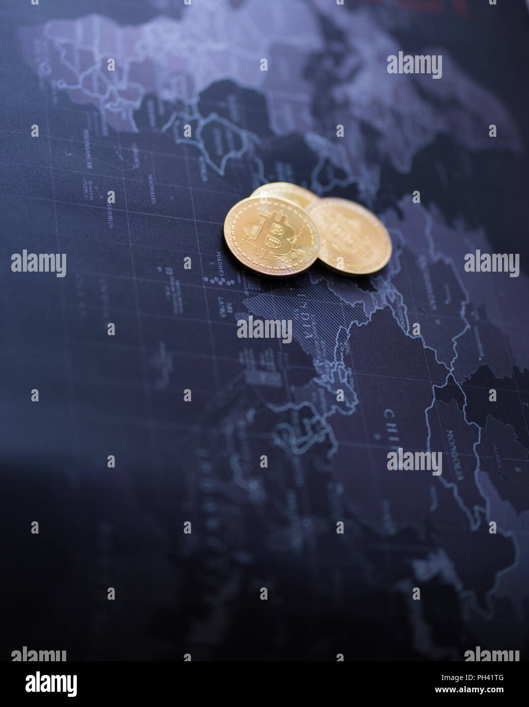 Cryptocurrency coin gold on blurred map world background, Stock Photo