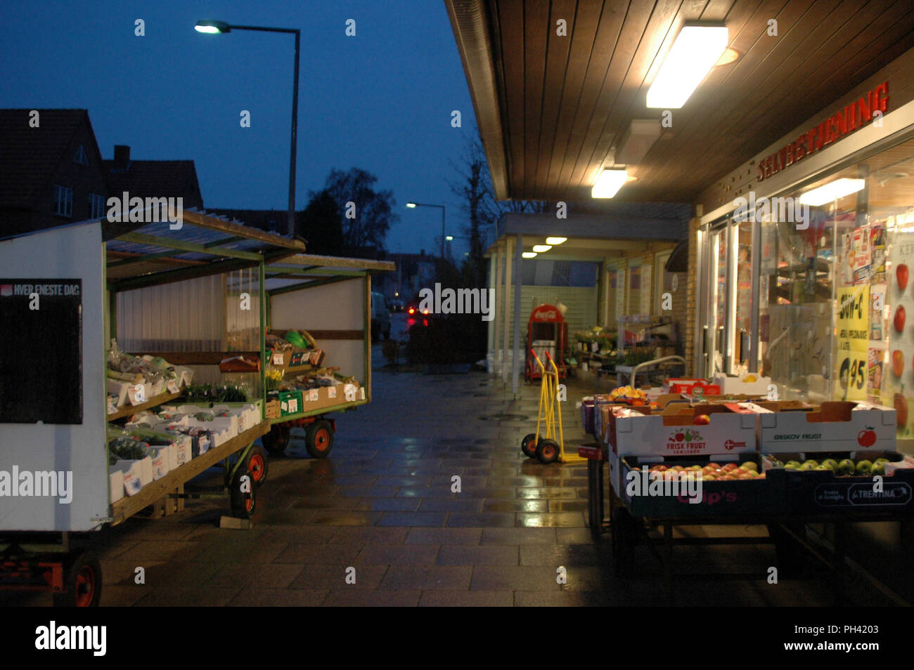 Sonderborg, Denmark - January 31, 2008: Small local market at evening, few minutes before closing time, the final closing for this littlle market. Stock Photo