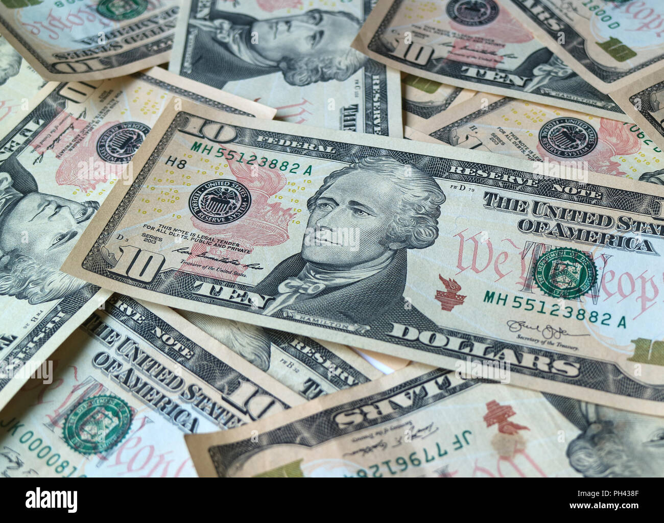 Close up pile of United States ten dollar (10) bills, for background