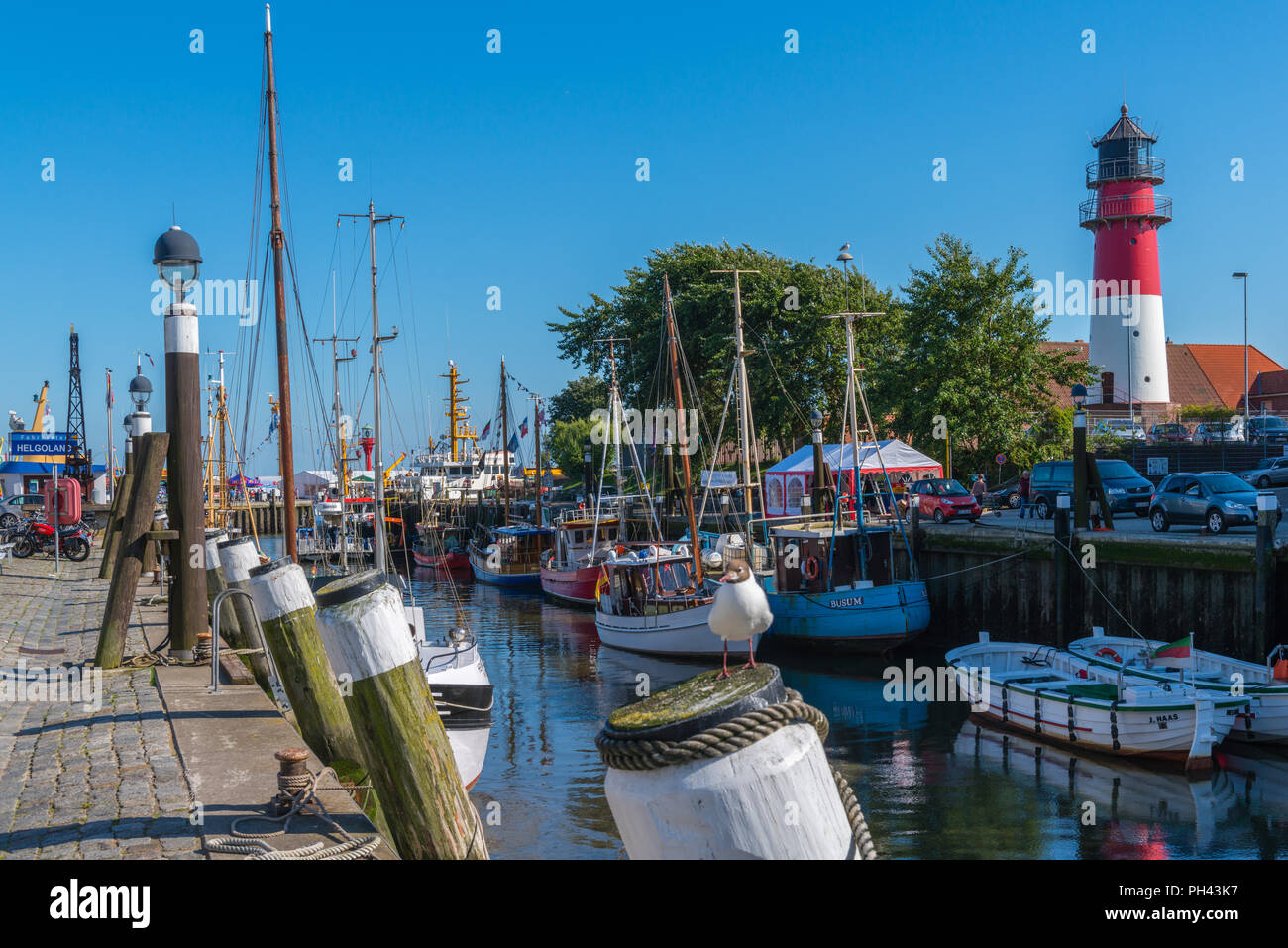 Habour scene with fishing boats, lighthouse, holiday resort, Büsum, Dithmarschen, Schleswig-Holstein, Germany, Europe Stock Photo