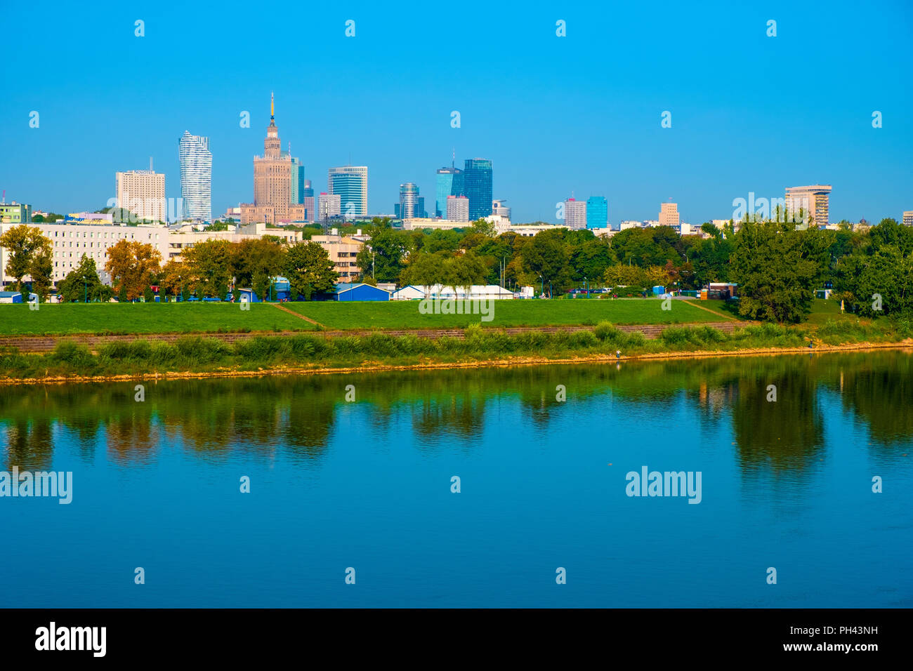 Warsaw, Mazovia / Poland - 2018/08/30: Panoramic view of the Warsaw city center skyscrapers and Solec district across the Vistula river Stock Photo