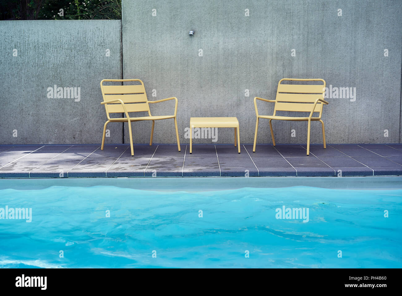 Yellow Chairs And Table In The Pool Side Stock Photo 217070168