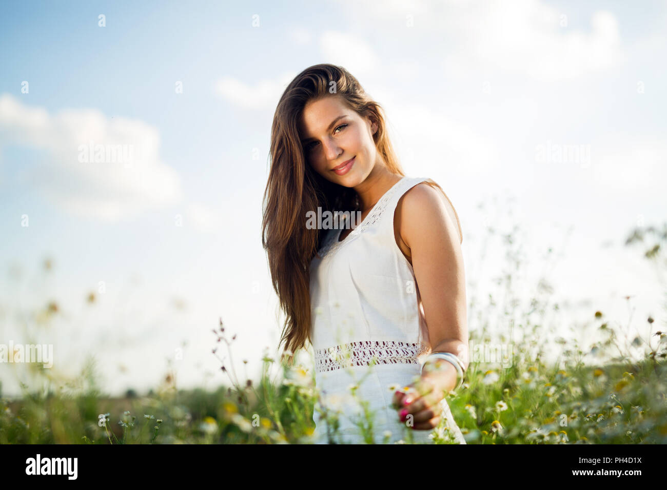 Young beautiful woman spending time in nature Stock Photo