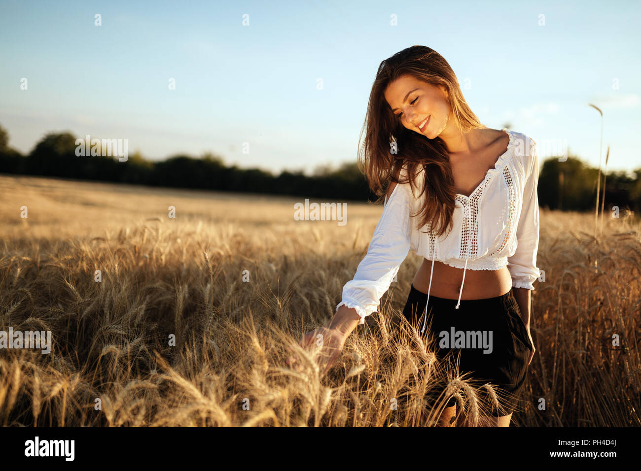 Young beautiful woman in nature Stock Photo - Alamy
