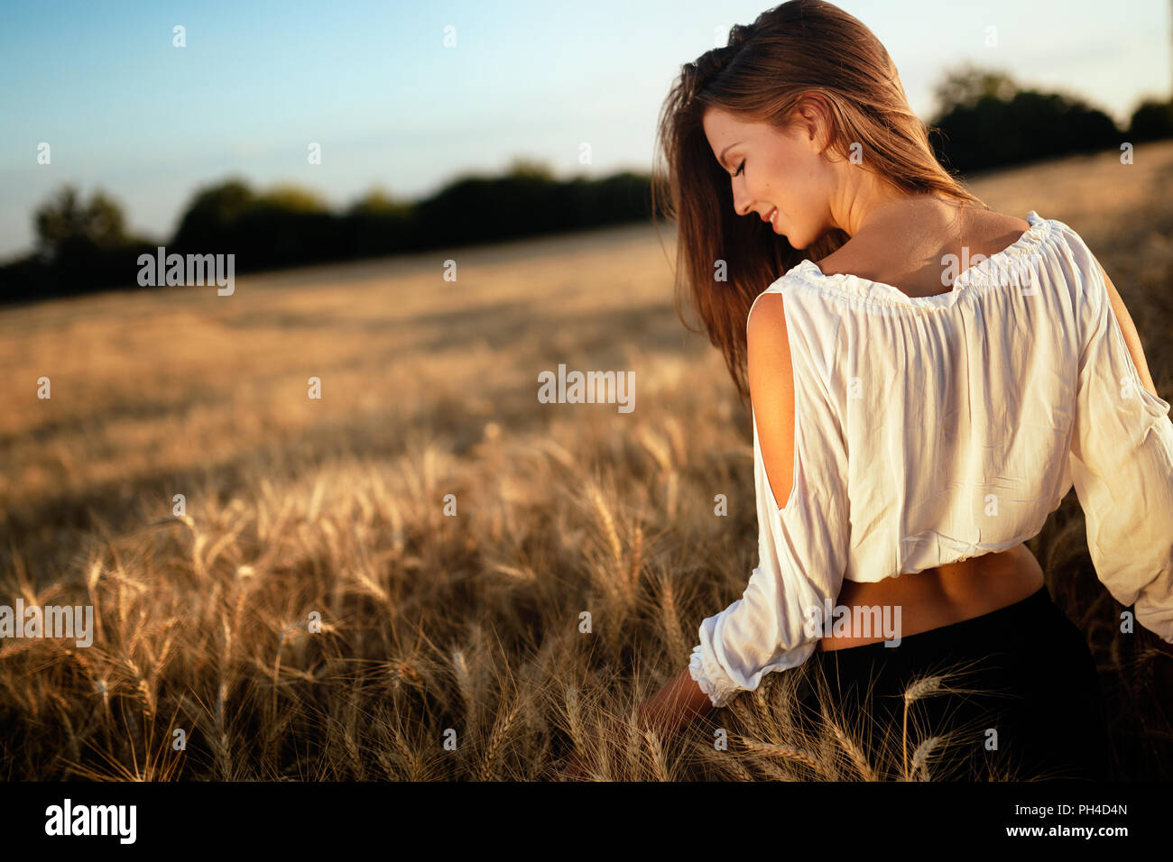 Young beautiful woman spending time in nature Stock Photo - Alamy