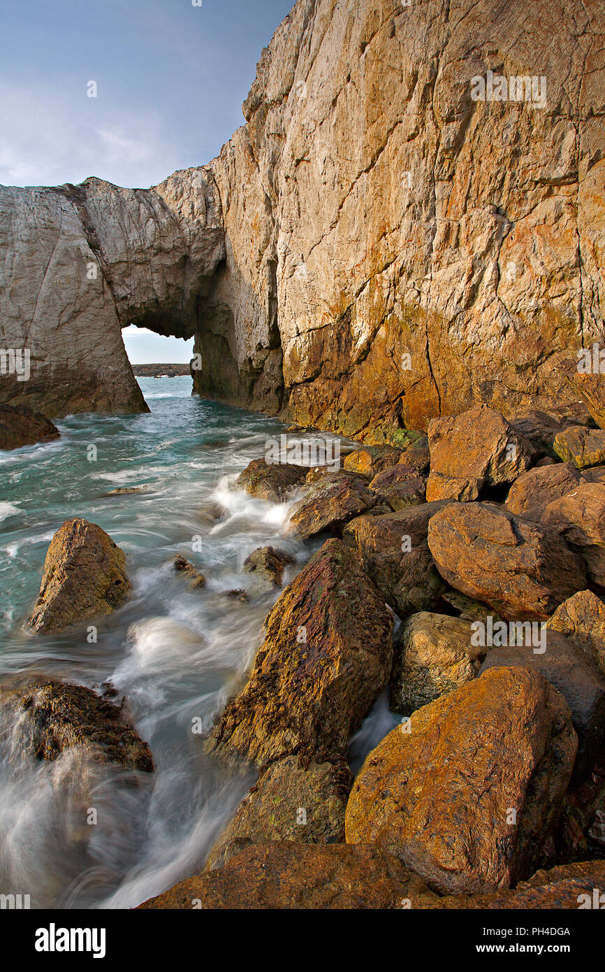 Bwa Gwyn sea arch on the coast of Anglesey, North Wales Stock Photo