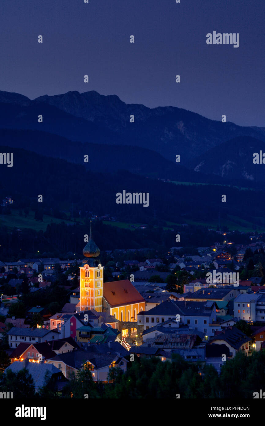 The town of Schladming, Austria, at dusk, set against the Dachstein Mountains Stock Photo