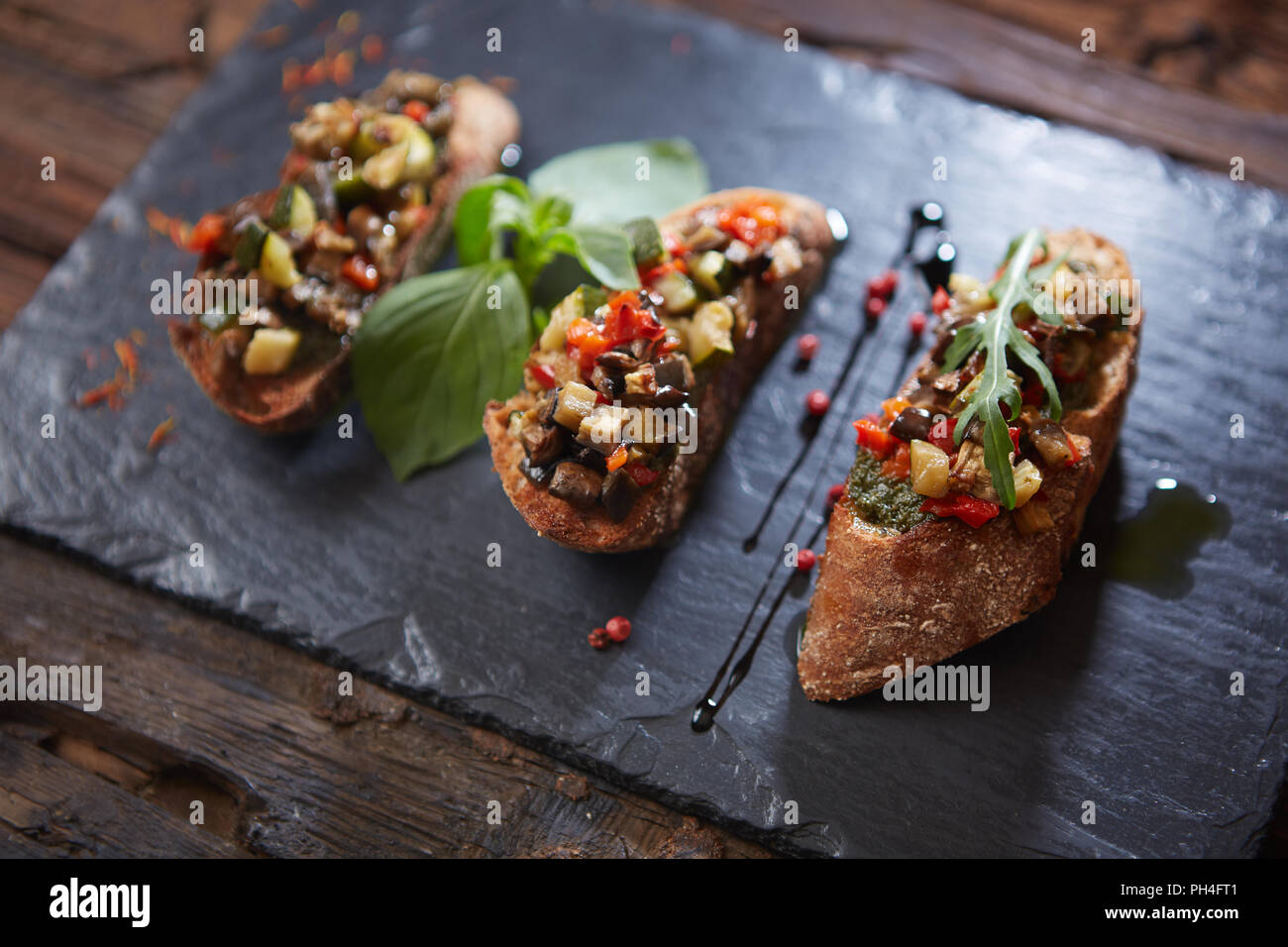 Healthy whole grain bread toast with sweet baked pepper and tomato