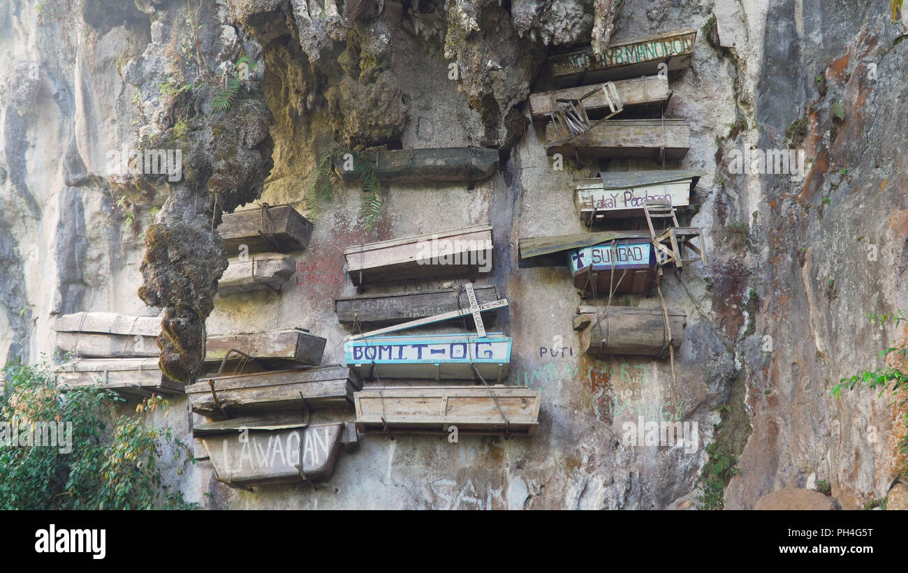 Tourist attraction Hanging coffins of Sagada. Philipphines hanging cemetery in the mountain cliff. Philippines, Luzon. Stock Photo