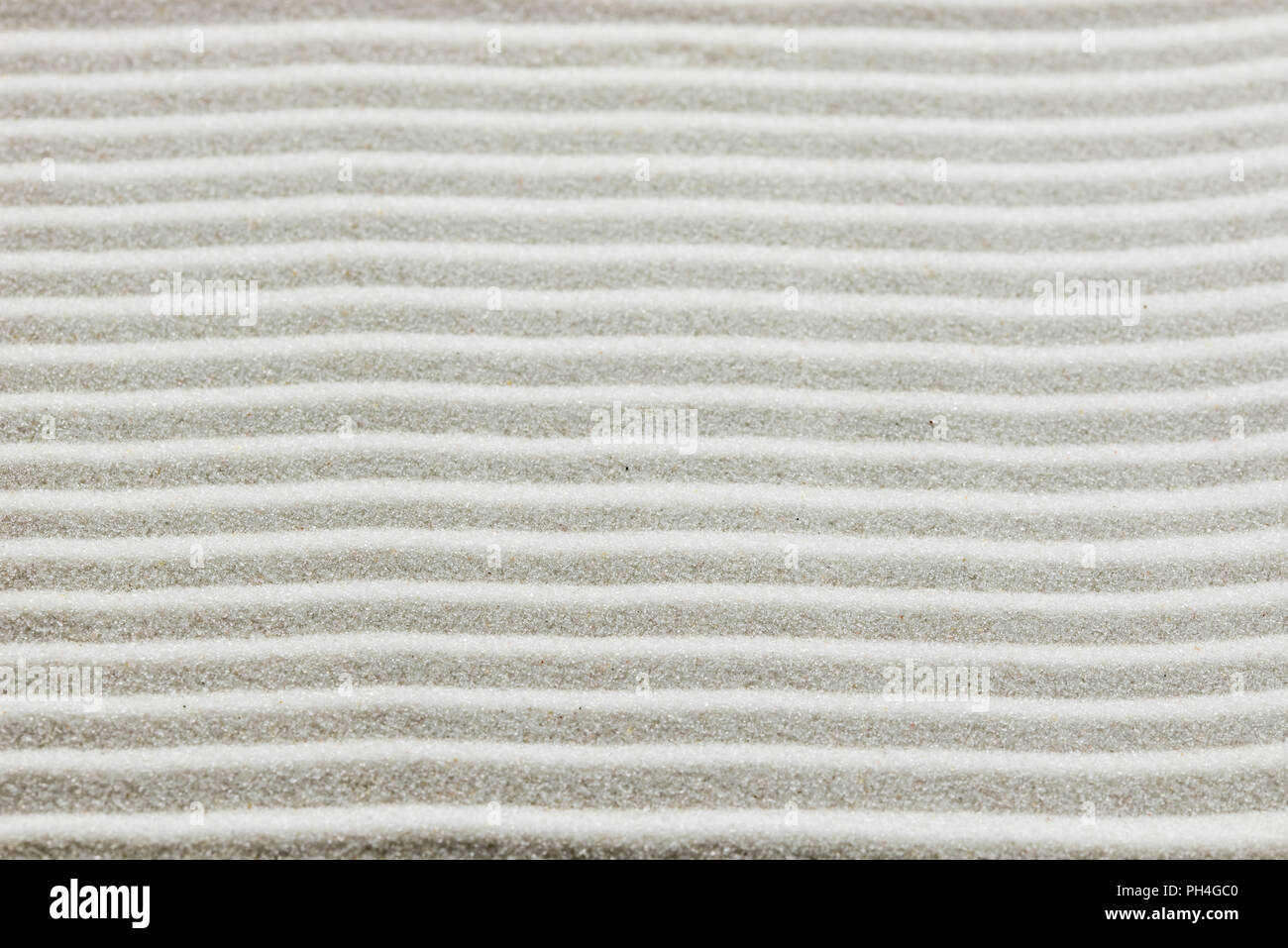 White Sand Rake Pattern Background pattern of raked white sand in parallel lines in a zen ...