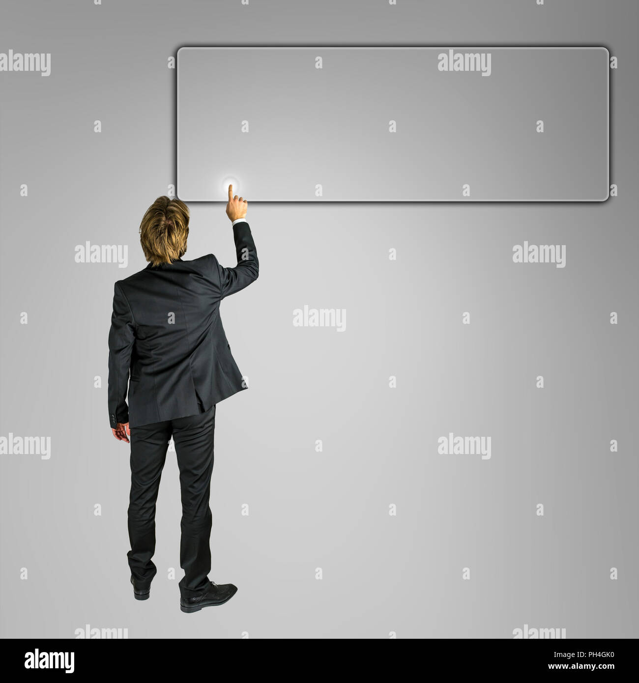 Businessman pushing empty button ready for your text on virtual screen. Stock Photo