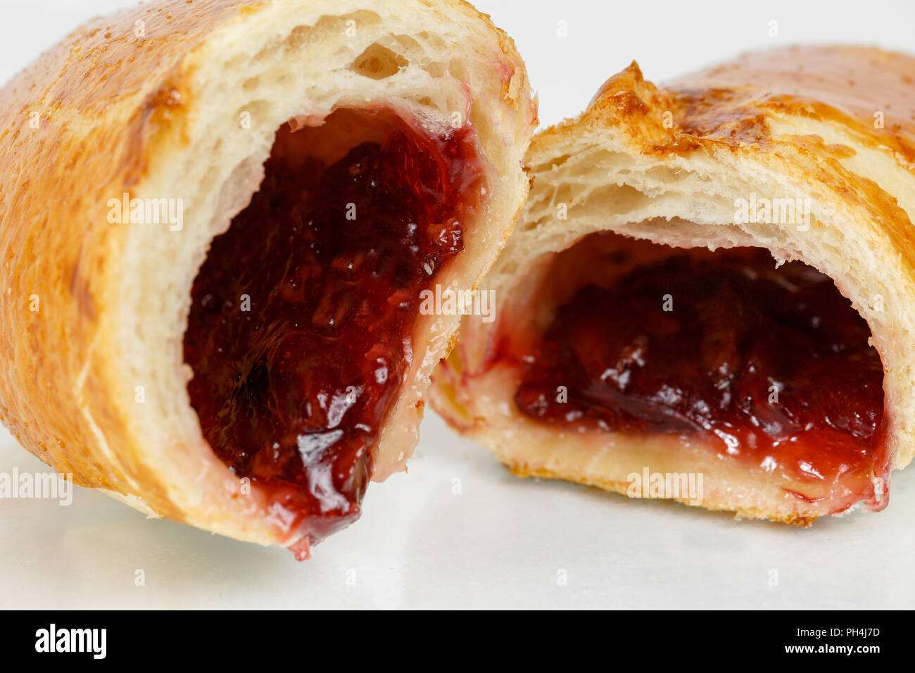 Tasty puff pastry dessert cut in half . Delicious pastries with fruit ...