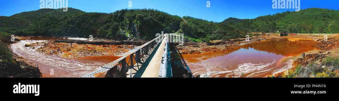 Panoramic view of the iron bridge of Cachan, which passes over the river Odiel, near the mines of Riotinto in the province of Huelva, Spain Stock Photo