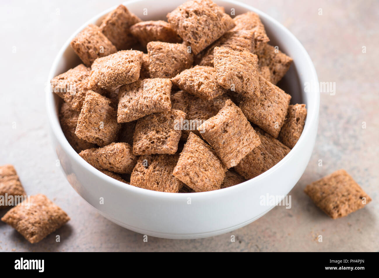 Chocolate pillows in white bowl Stock Photo Alamy