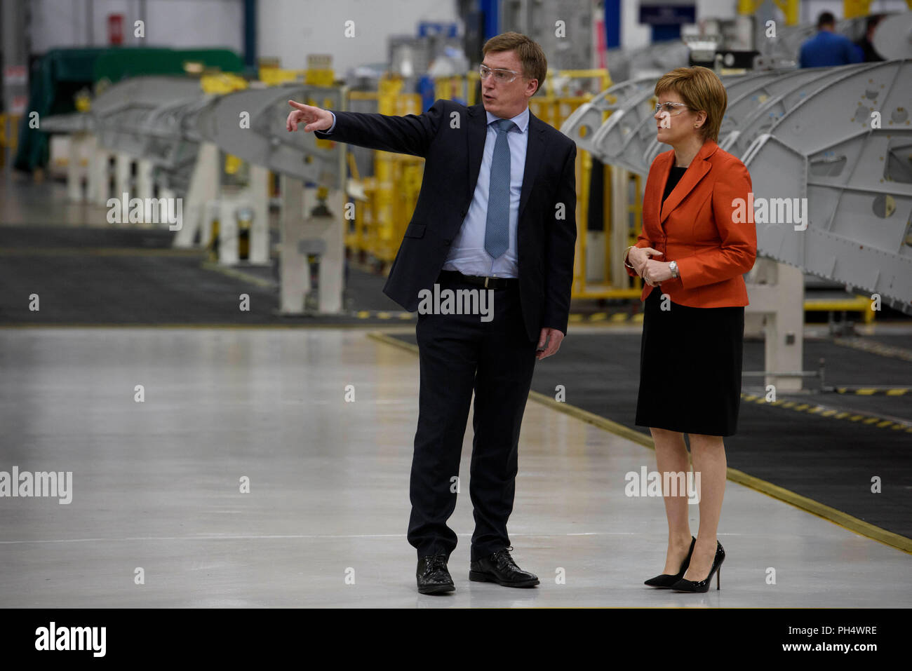 First Minister Nicola Sturgeon Stands With Scott Mclarty Vice President Of Spirit Aerosystems Uk And Malaysia During A Visit To Spirit Aerosystems Near Prestwick Airport In Ayrshire Where She Met Apprentices And