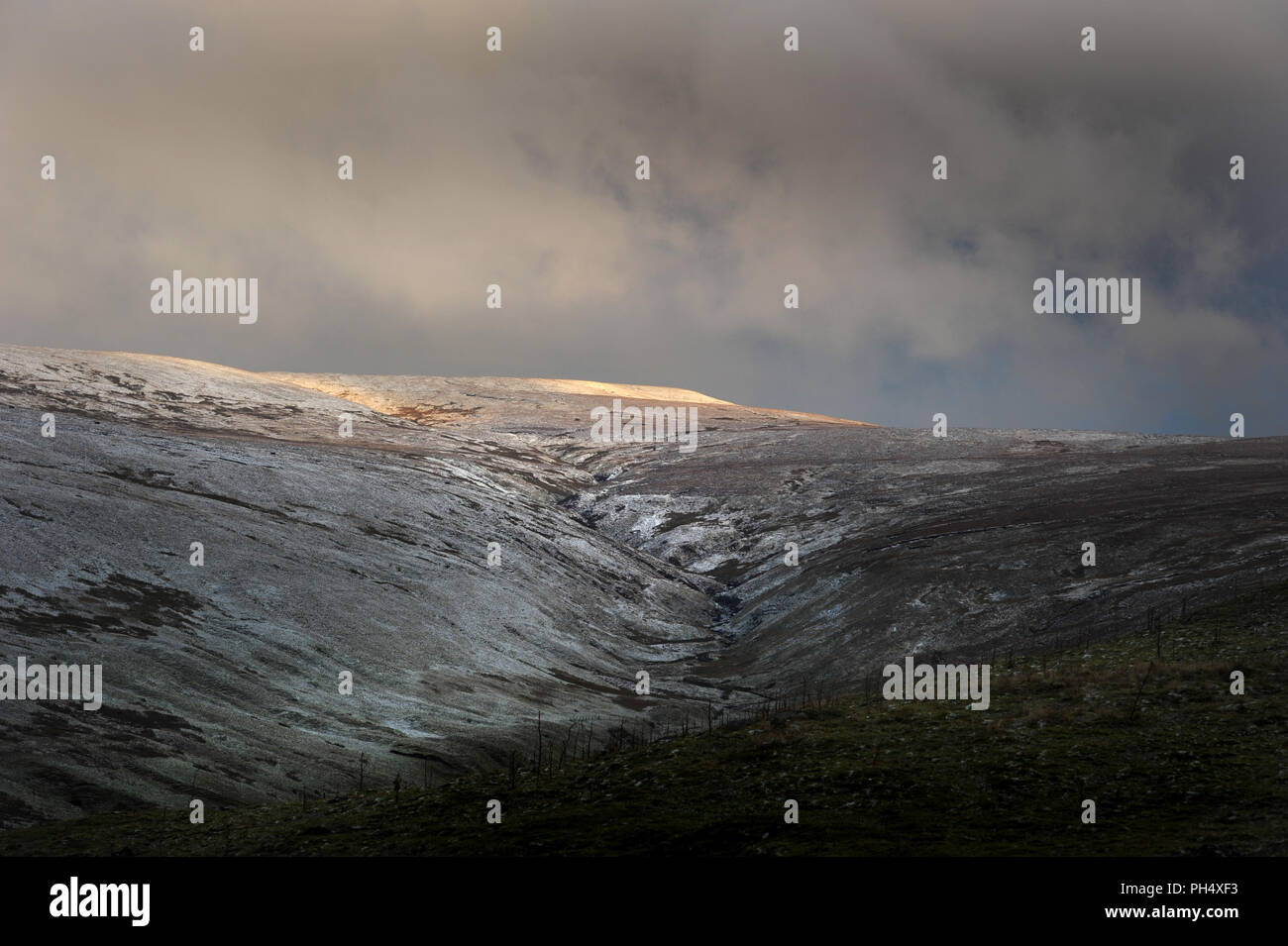 Great Shunner Fell on a cold, bleak winter morning. Wintry light is on the top of the fell. Swalesdale, Yorkshire Dales, England, Britain Stock Photo
