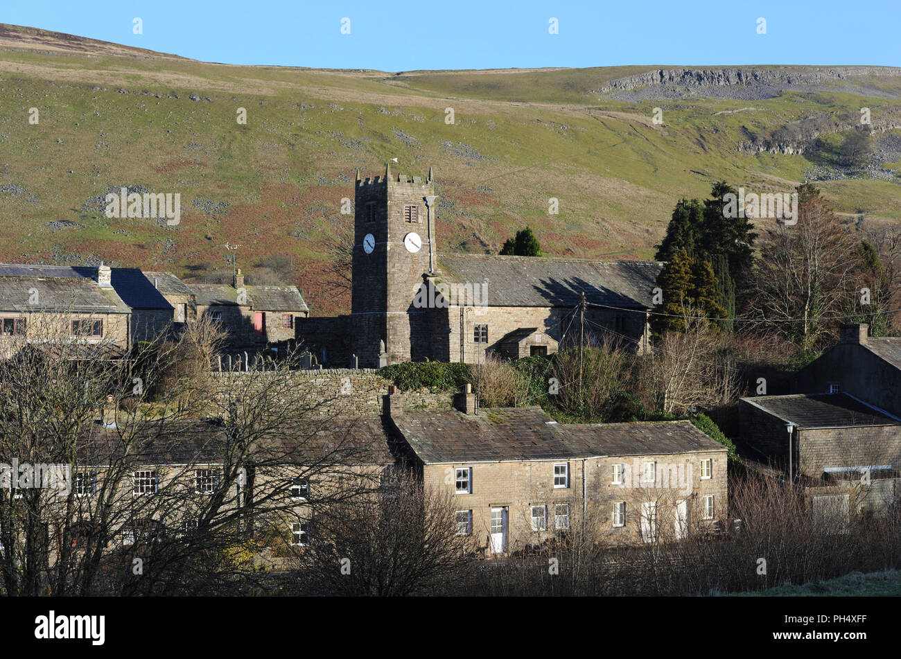 St Mary's Church in the village of Muker, Swaledale, Yorkshire Dales, Britain. The church tower clock reads 10.20 Stock Photo