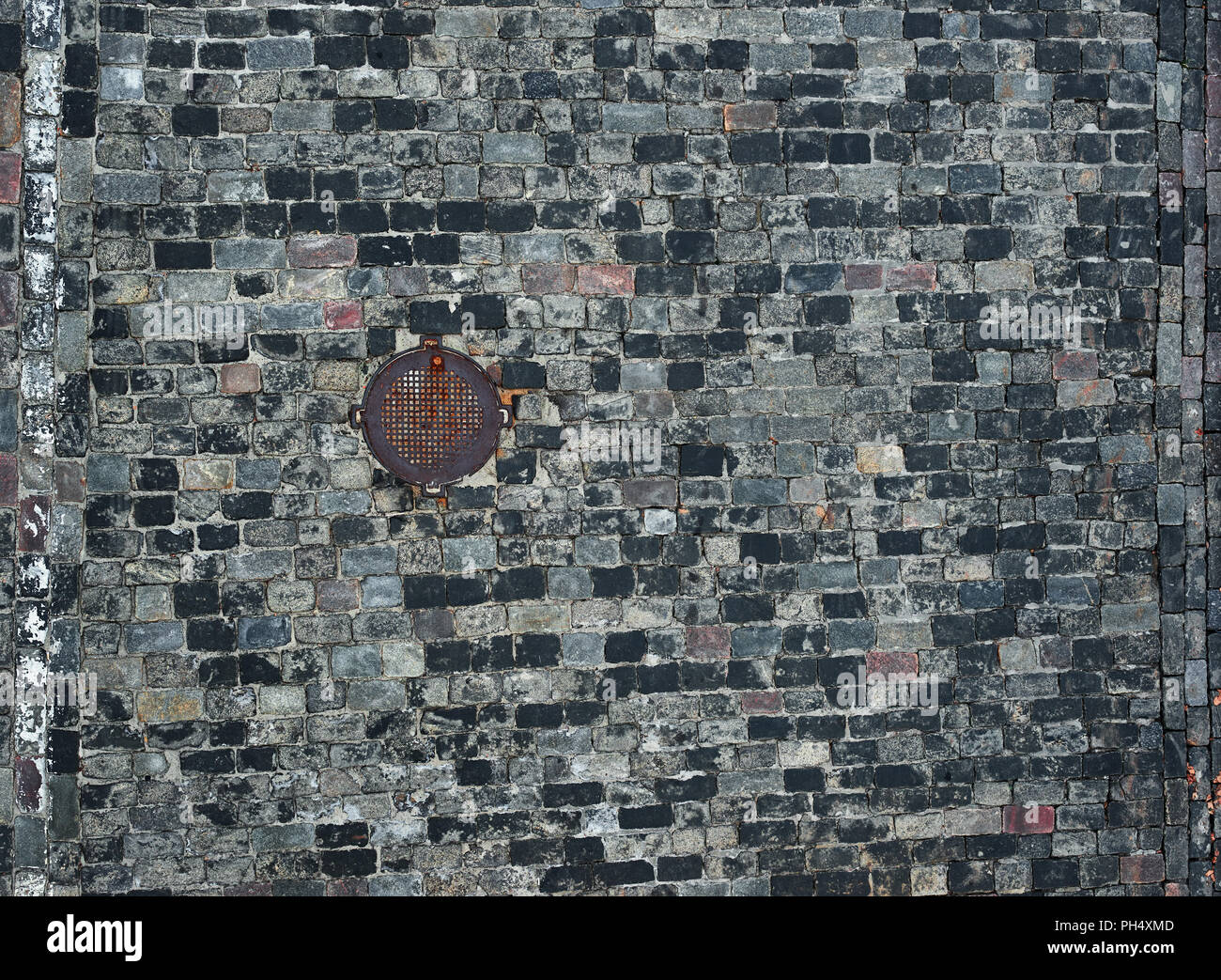 old cobblestone road with hatch for background or texture Stock Photo ...