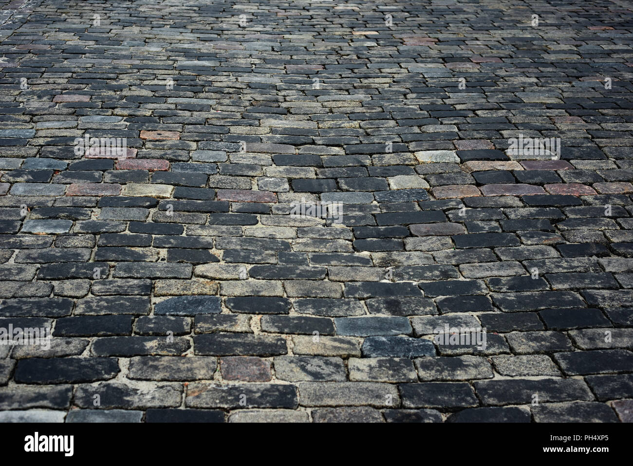 old cobblestone road for background or texture Stock Photo - Alamy