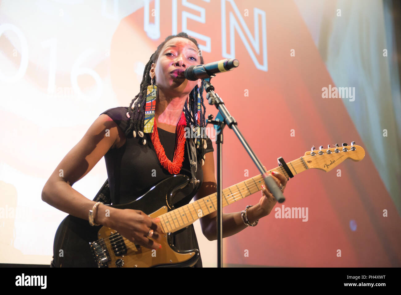 actress and musician Fatoumata Diawara performs before the screening of her Film 'Mali Blues' at the Filmfest München 2016 Stock Photo