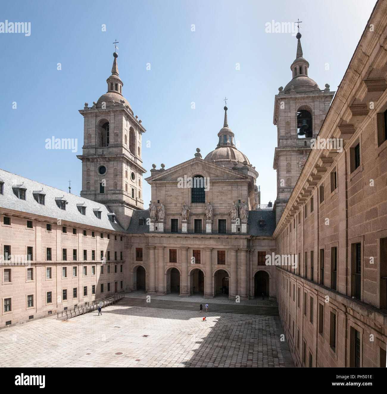 The Patio de los Reyes, Courtyard of the Kings, and facade of the Basilica in the Monastery of San Lorenzo de El Escorial, Comunidad de Madrid, Spain. Stock Photo