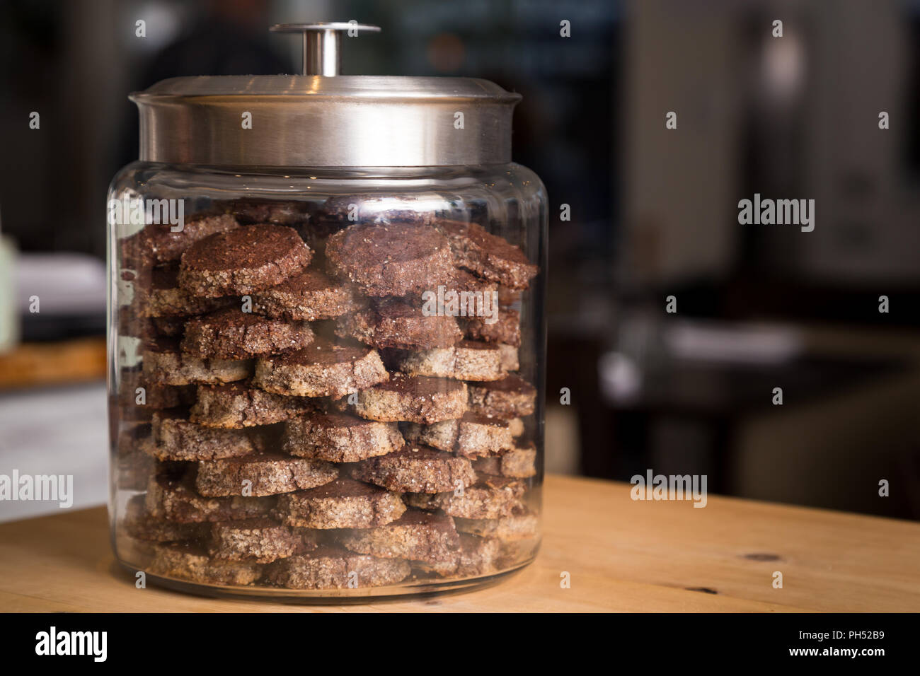 A cookie stored in an airtight glass cookie jar Stock Photo - Alamy