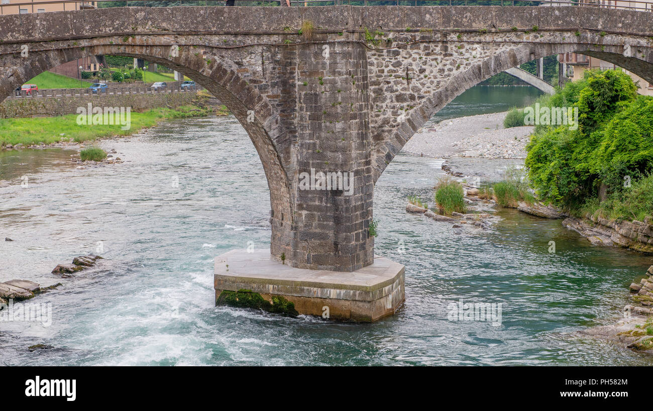 Roman bridge on the river brembo in San Giovanni Bianco Stock Photo