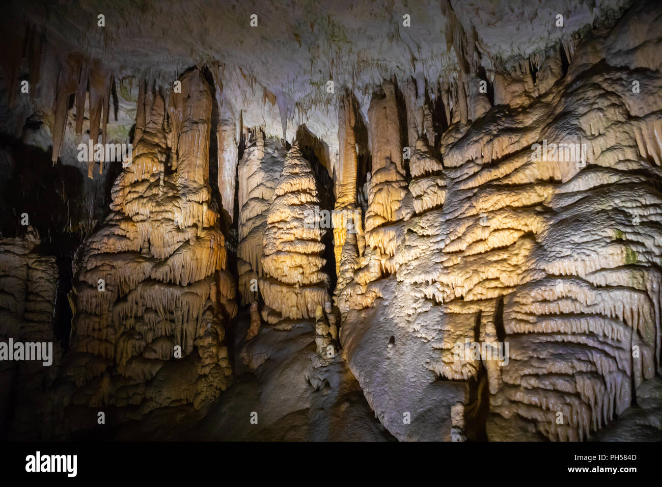 View of stalactites and stalagmites in an underground cavern - Postojna cave, Slovenia Stock Photo