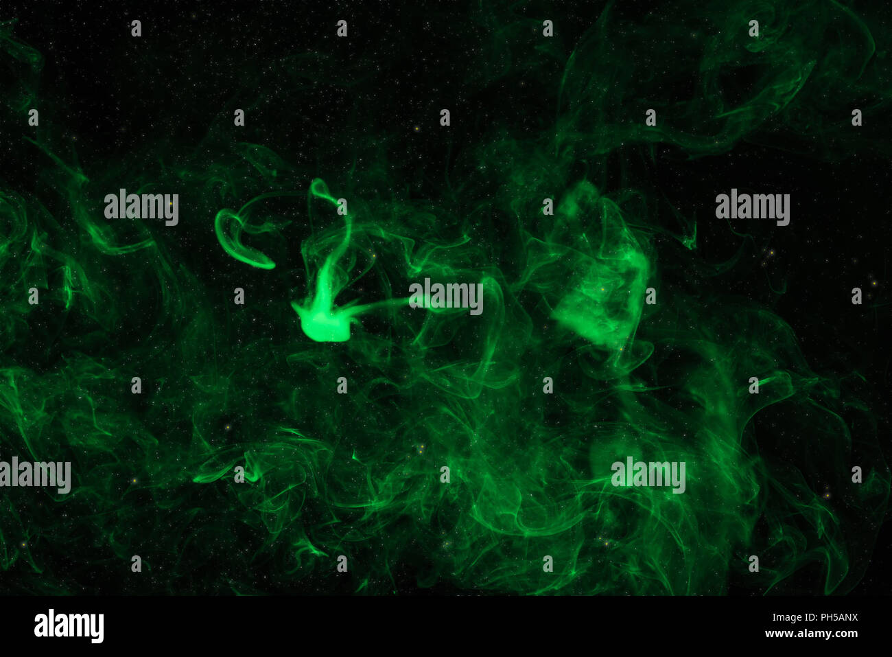 mystical background with green smoke on black Stock Photo - Alamy