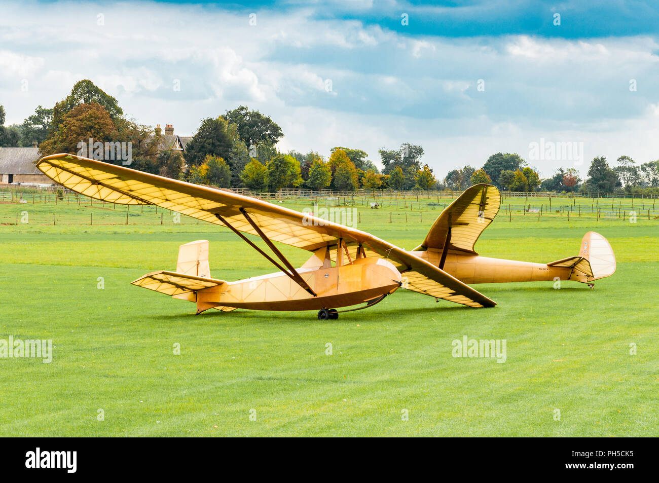 Two plywood gliders in a field Stock Photo