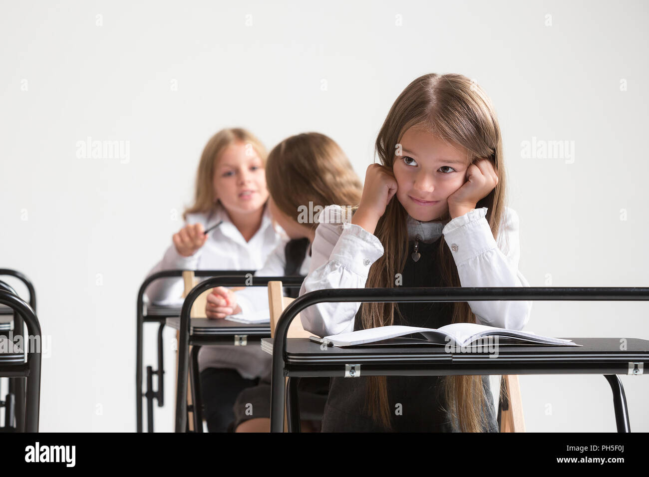 School Children In Classroom At Lesson The Little Boys And Girls