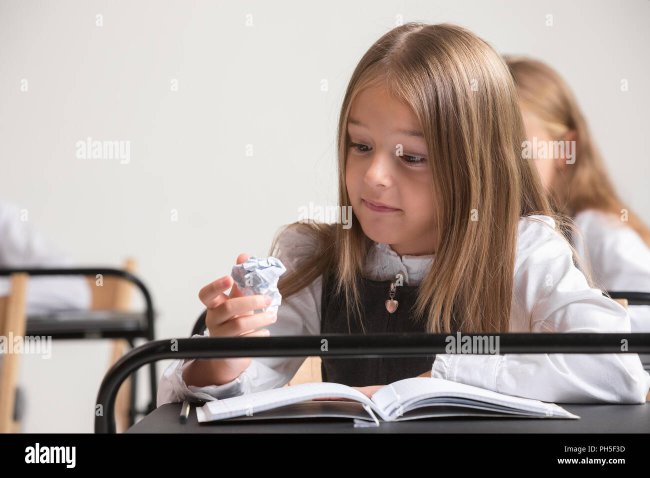 School Children In Classroom At Lesson The Little Boys And Girls