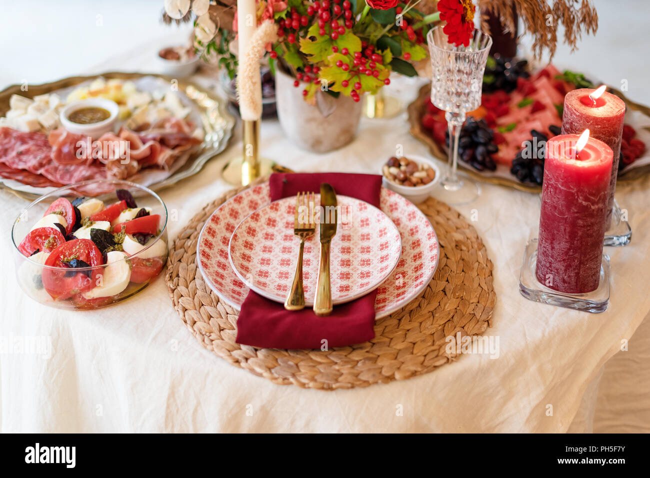 Luxury table settings for fine dining with candles and glassware