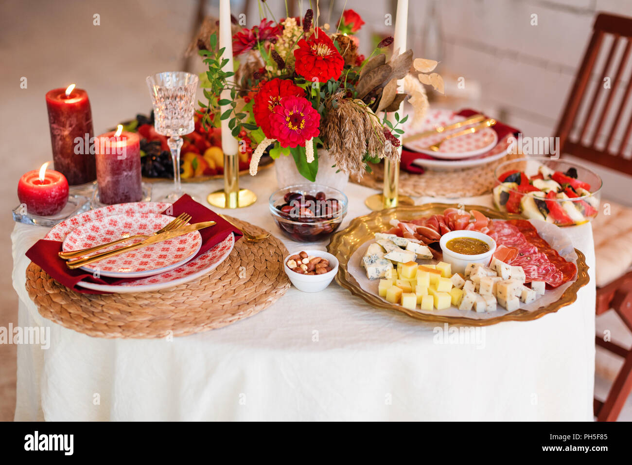 Luxury table settings for fine dining with candles and glassware