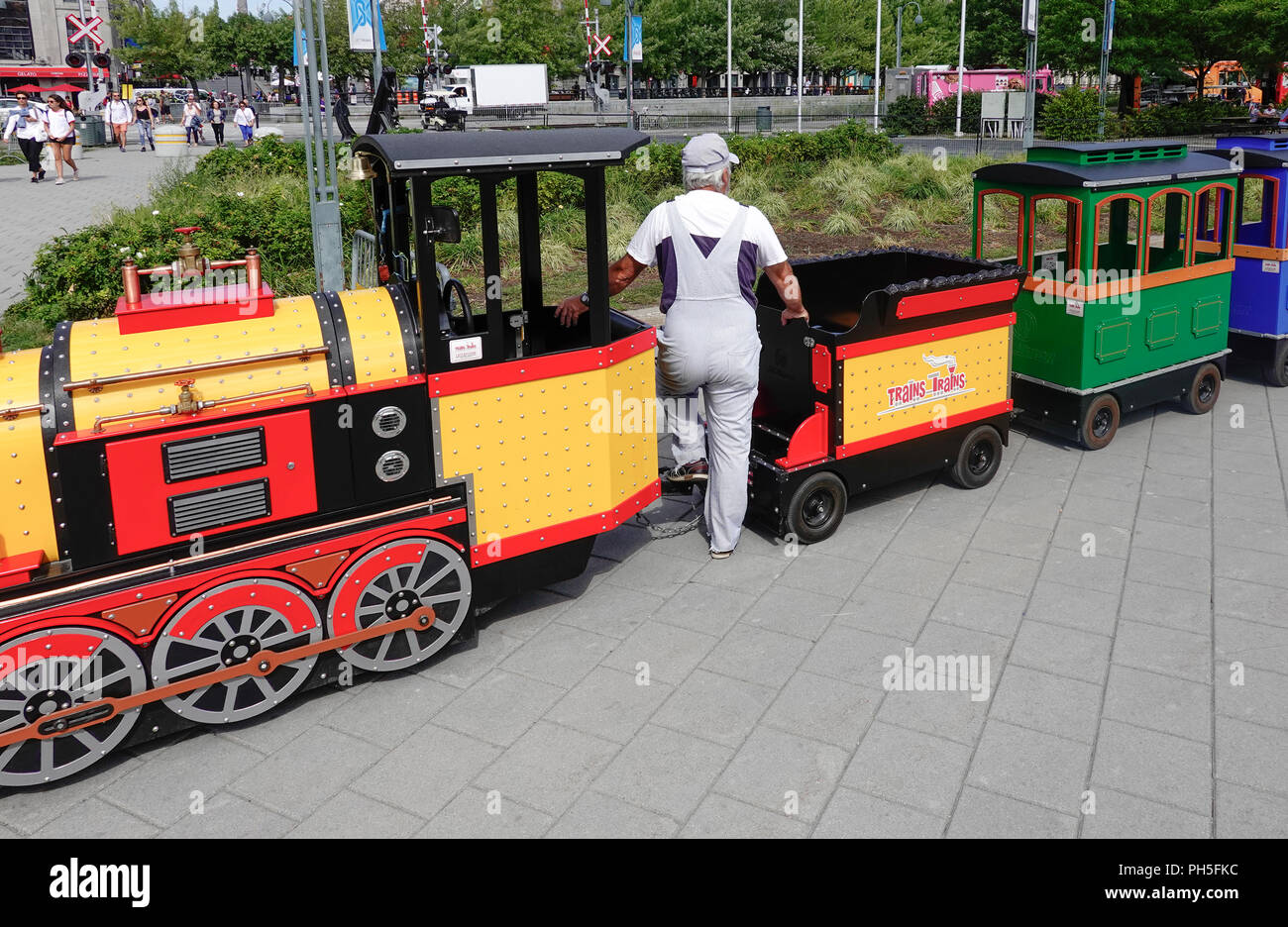 A children's toy steam engine train ride at the Old Port in Montreal, QC, Canada Stock Photo