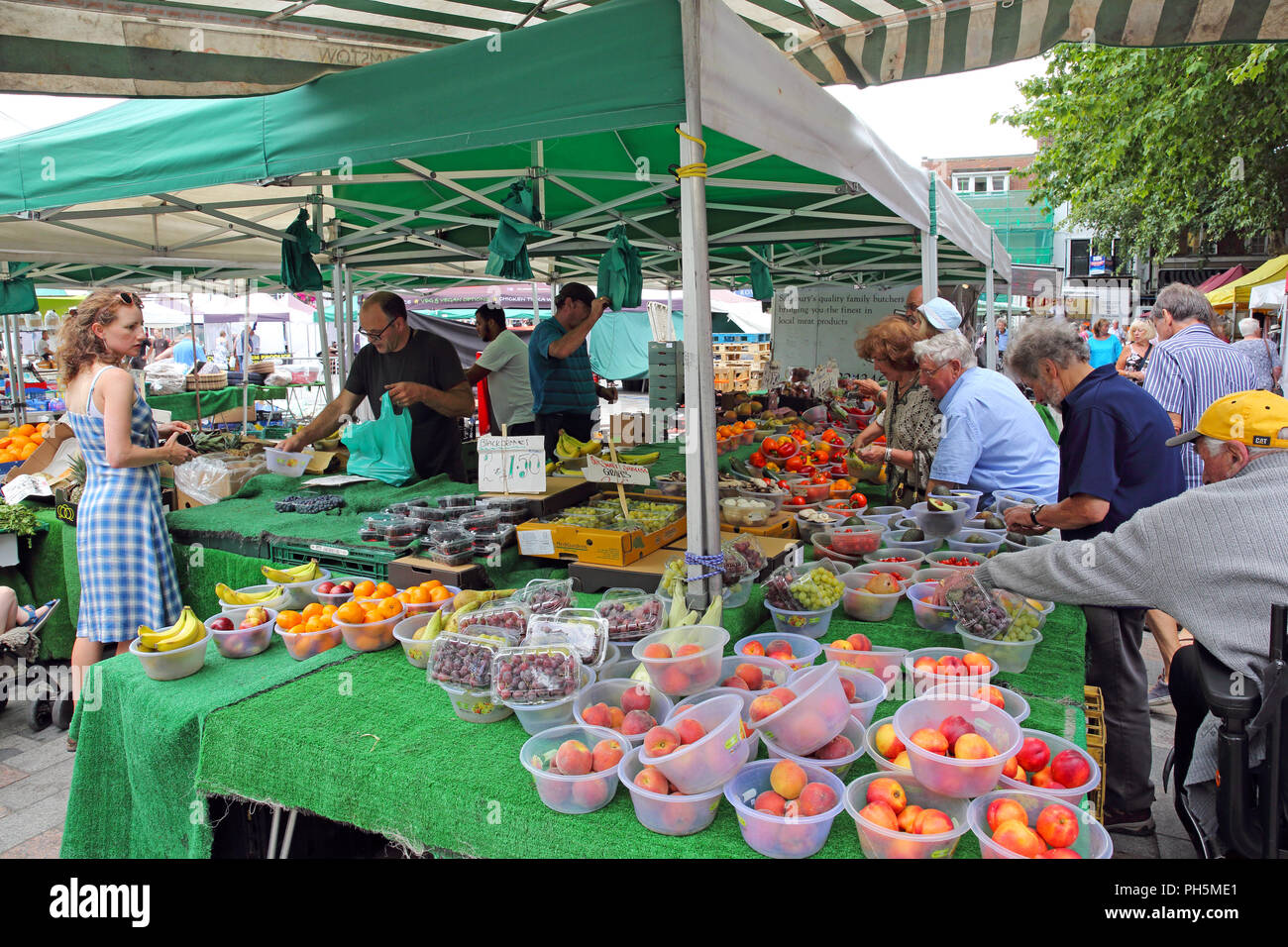 Busy fruit market stall in the city of Salisbury, Wiltshire, England, UK. Stock Photo