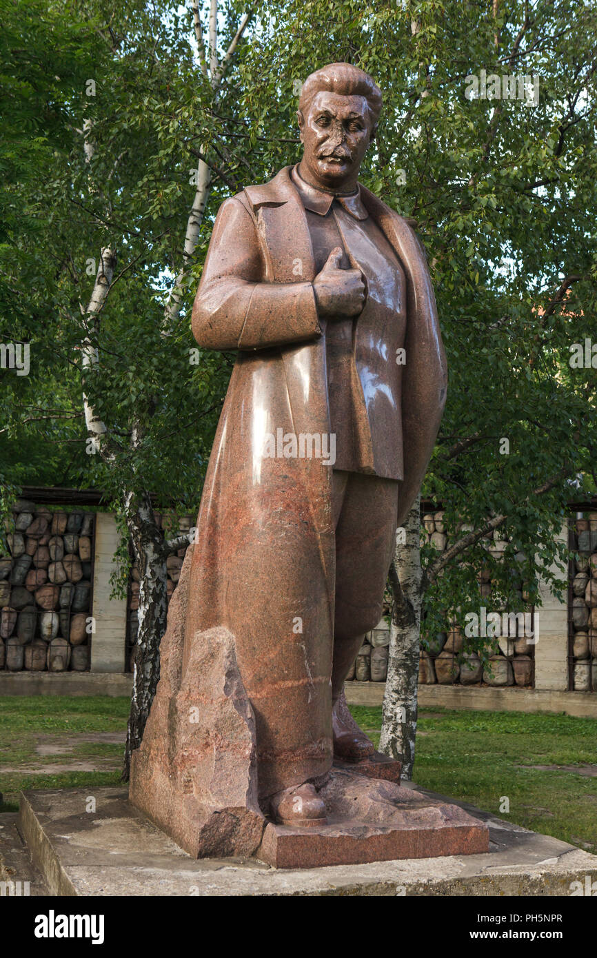 Monument to Soviet dictator Joseph Stalin designed by Soviet sculptor Sergey Merkurov (1938) on display in the Muzeon Fallen Monument Park in Moscow, Russia. The pink granite statue was exhibited for the first time in the Soviet Pavilion at the 1939 New York World's Fair. Stock Photo