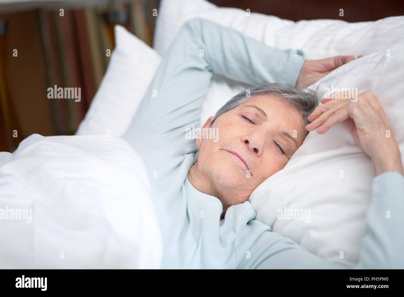 Elderly woman getting a good nights rest. Stock Photo