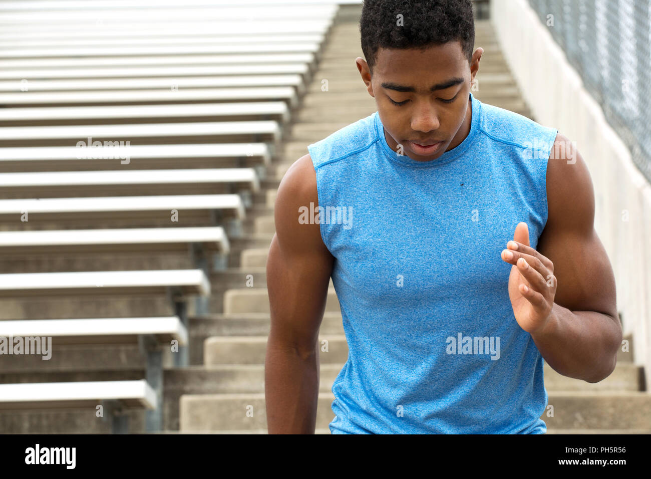 Teenage athlete running the bleachers Stock Photo Alamy