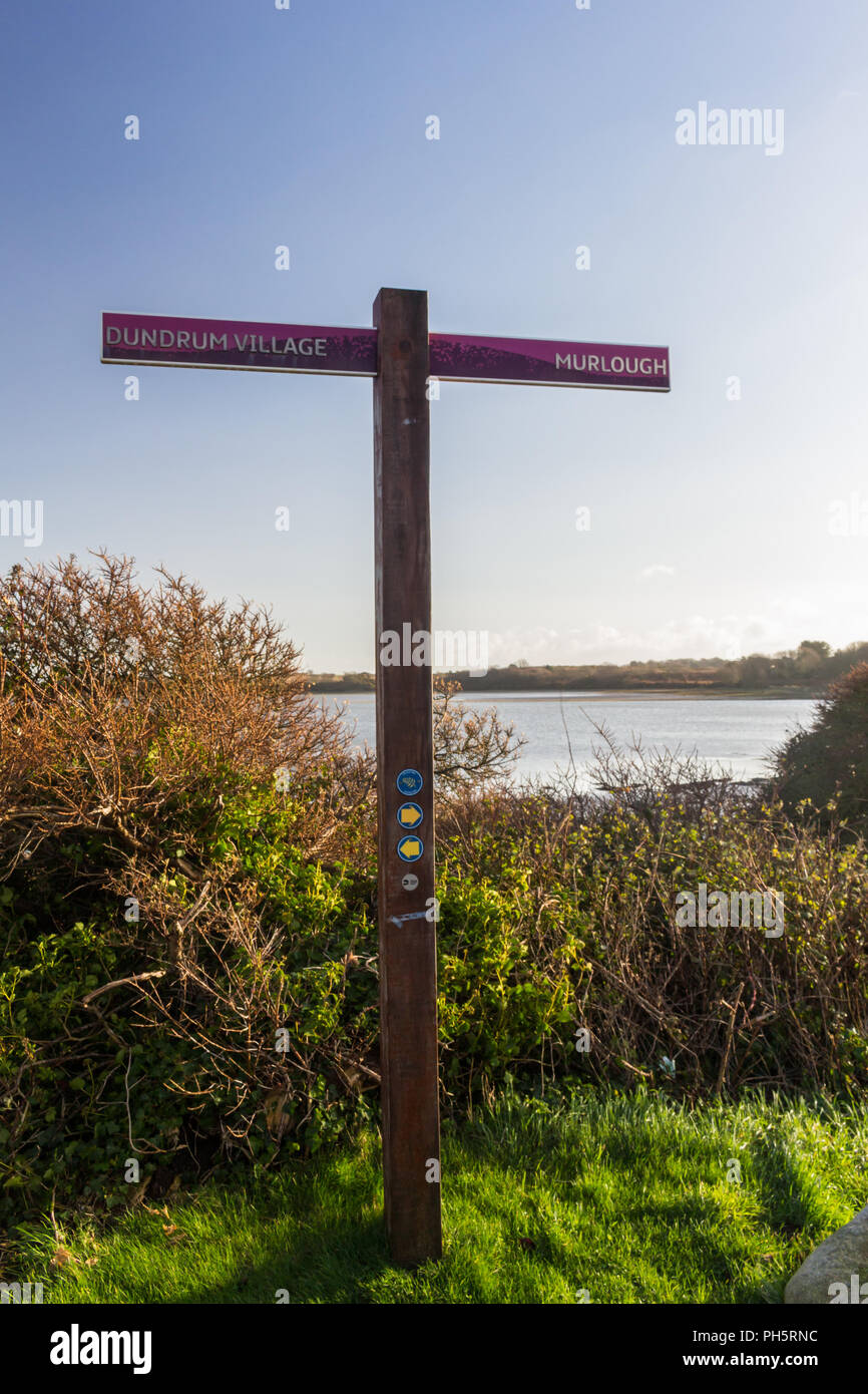 A Lecale Way route sign, part of the Ulster Way, long distance walking route. Dundrum Village and Murlough Beach signposted near Dundrum,  County Down Stock Photo